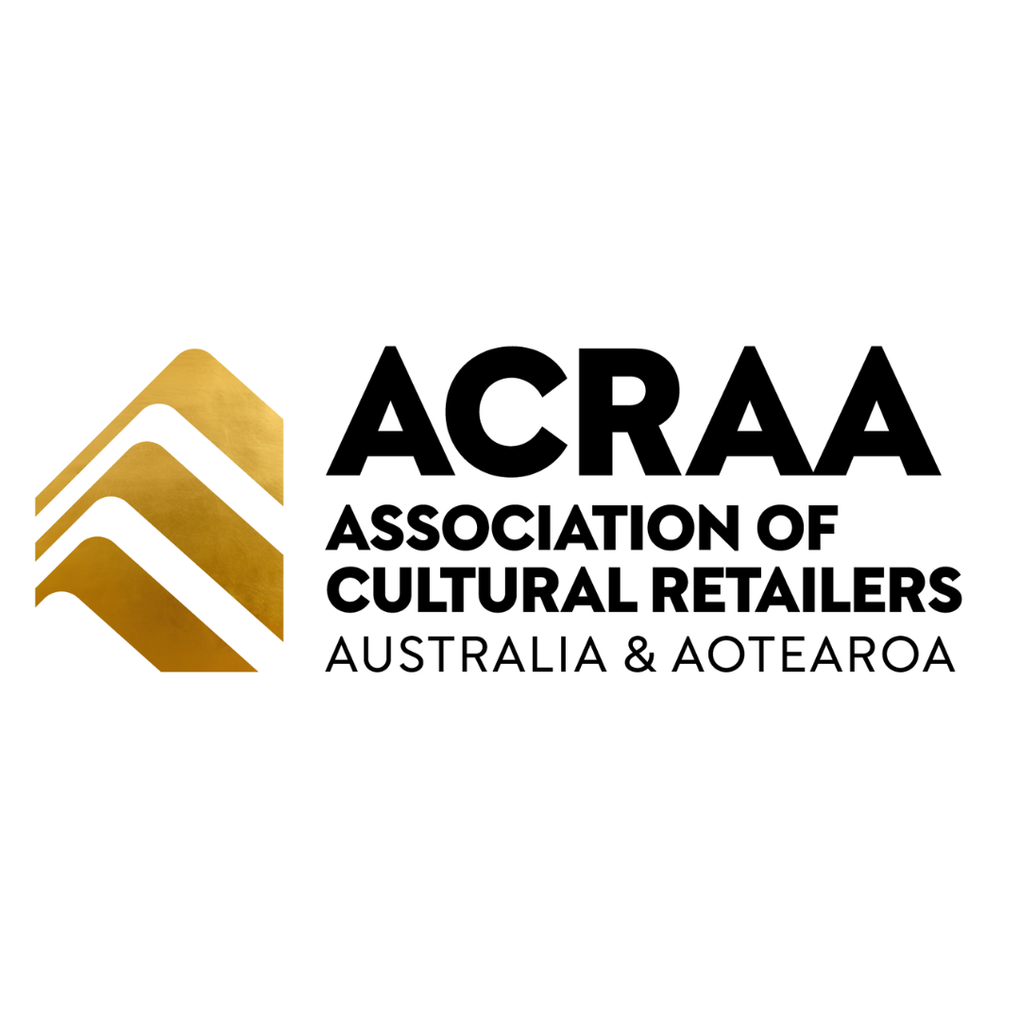 Logo of ACRAA, Association of Cultural Retailers Australia & Aotearoa, with gold and black design elements on a white background.